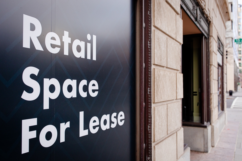 Retail Space For Lease sign on display outside a building, copy space. Commercial business for lease signage 